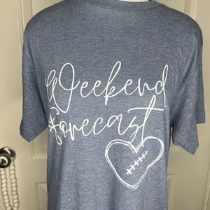 Blue Graphic Tee with football heart “weekend forecast”